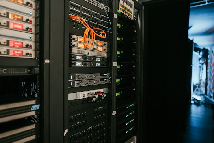 Close-up of server rack hardware with blinking status LEDs